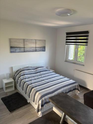 Ένα ή περισσότερα κρεβάτια σε δωμάτιο στο Studio Apartman NoNa