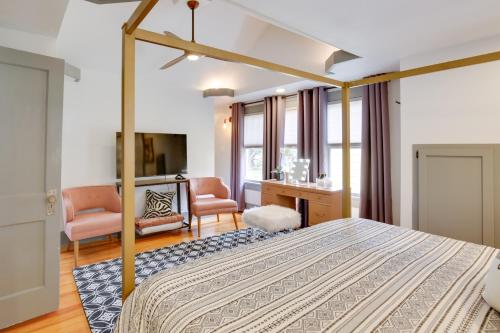 a bedroom with a bed and a desk at Renovated Lubbock Home - Walk to Texas Tech! in Lubbock