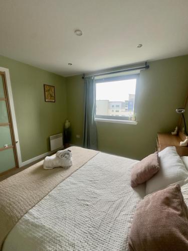Katil atau katil-katil dalam bilik di Ocean view flat with cozy vibes