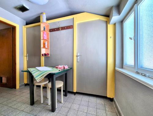 a dining room with a table and two chairs at Nattersbergalm in Reit im Winkl