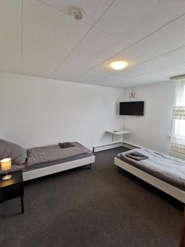 Postel nebo postele na pokoji v ubytování Worker Apartment Neu-Ulm