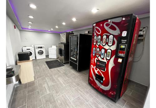 a red soda machine in a room with machines at Studio 6 Lafayette, LA I-10 & I-49 N in Lafayette