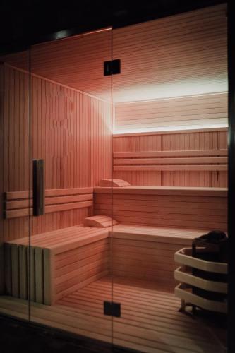 a large empty sauna with wooden walls and benches at Grand Brizo Bel Air in Buenos Aires
