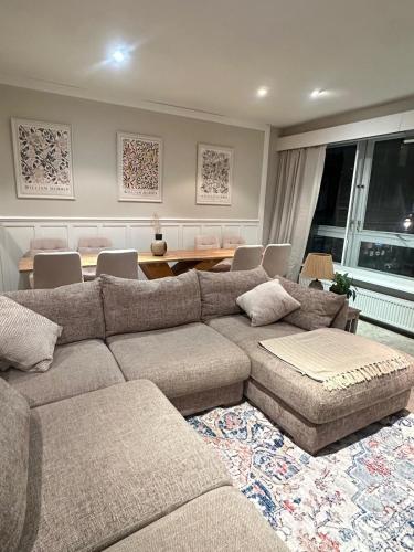 a living room with a couch and a dining room at Duplex - City Centre 4-Bed Retreat in Edinburgh