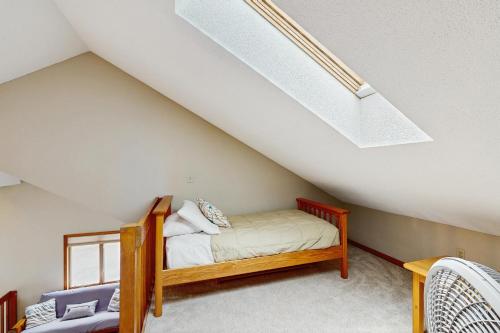 a bedroom with a bed in a attic at North Conway Townhouse 3H in North Conway