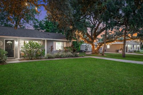 a house with a green lawn in front of it at Nature Coast Getaway #1 - Cozy 2 Bedroom in Homosassa