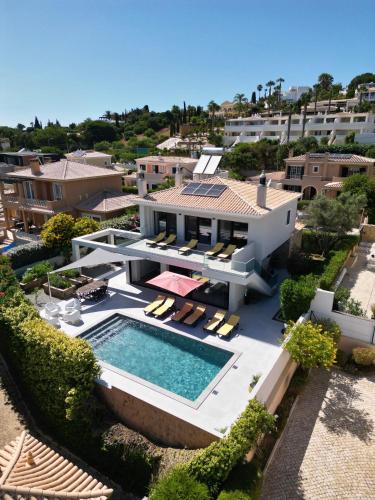 an aerial view of a house with a swimming pool at Casa Talay 4 Bedroom Pool Villa - Meia Praia Beach, Lagos in Lagos