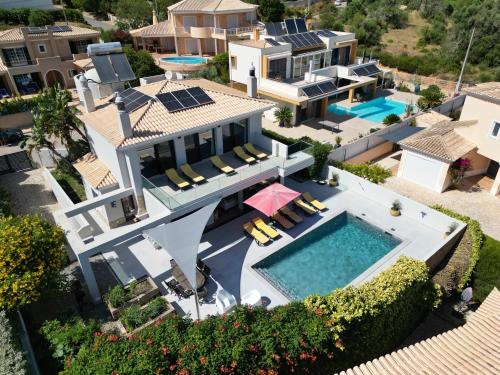an aerial view of a house with a swimming pool at Casa Talay 4 Bedroom Pool Villa - Meia Praia Beach, Lagos in Lagos