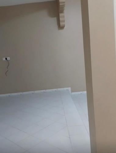 a room with a white wall with a faucet at Appartement Dakar,Niakoulrap in Darou Rhamane