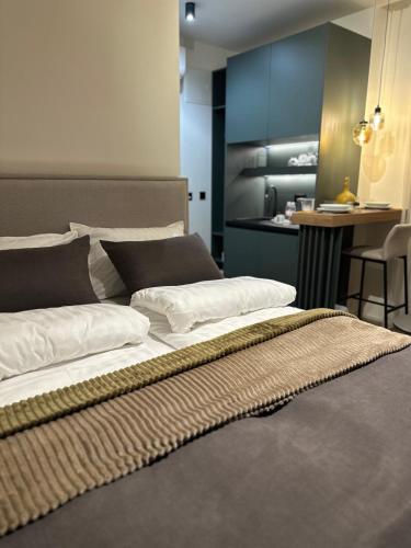 Ένα ή περισσότερα κρεβάτια σε δωμάτιο στο Four Elements Apartments