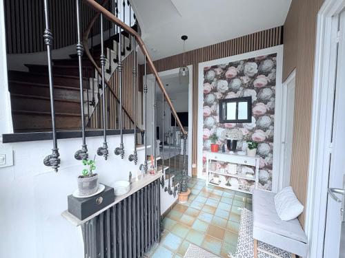 a staircase in a house with a staircase at Magnificent Bourgeois Residence on Wooded Estate in Charleville-Mézières