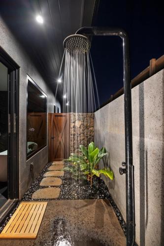 a shower in a bathroom with at Hale O Ka Nene in Koloa