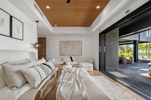 a living room with a white couch and a table at Hale O Ka Nene in Koloa