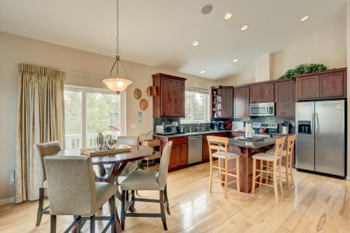 a kitchen with wooden cabinets and a table with chairs at Mountain-View Eden in South Lake Tahoe