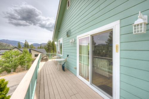 a porch of a blue house with a glass door at Mountain-View Eden in South Lake Tahoe