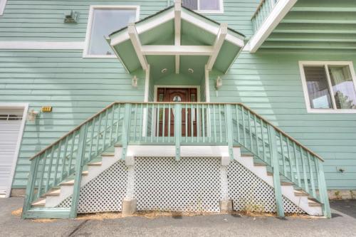 a front porch of a house with a green railing at Mountain-View Eden in South Lake Tahoe