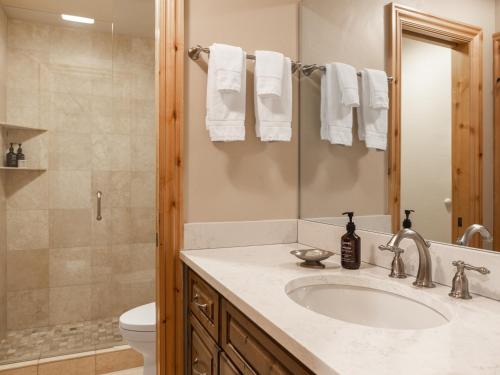a bathroom with a sink and a toilet and a shower at Montaneros in Vail in Vail