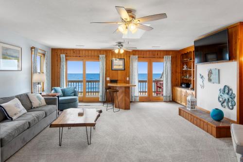 a living room with a couch and a table at The Lily Pad in Nags Head
