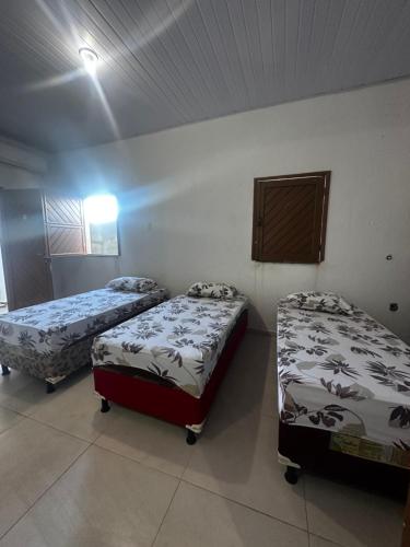 Postel nebo postele na pokoji v ubytování Pousada e hostel Costa do Sol Coroa Vermelha