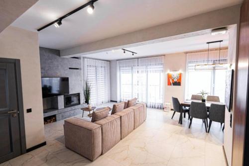 a large living room with a couch and a table at Chalet 348 in Palyanytsya