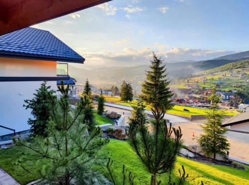 a view from the balcony of a house with trees at Chalet 348 in Palyanytsya