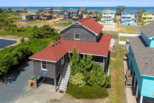 an aerial view of a house with a red roof at Marlin Manor by Village Realty in Nags Head