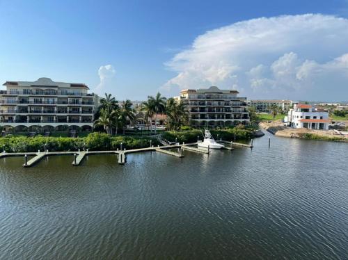 a boat is docked at a dock in a body of water at Departamento en Marina Mazatlán in Mazatlán