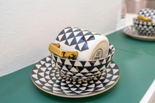 a black and white cake on a plate on a table at Emerald Luxe Lakeview 6 min to EPIC Universe in Orlando