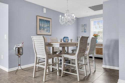 a dining room with a table and chairs at Waterfront Retreat with Dock and Bay Views in Seaside Heights