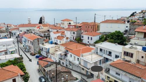 an aerial view of a city with buildings at Elymnion Horizon in Limne