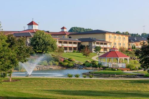 a resort with a pond and a gazebo at Berlin Resort in Millersburg