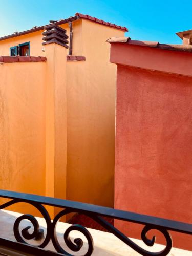 a bench sitting in front of a building at Bia Apartments in Monte Marcello