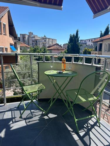 a balcony with a table and two chairs on it at Boutique Villa Aura Ohrid in Ohrid