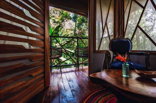 a room with a table and chairs and a window at Burú Nature Hotel in Leticia