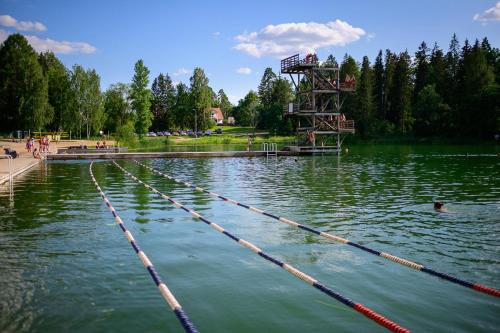 a large lake with a lifeguard tower in the middle at Suve vacation home in Tõrva