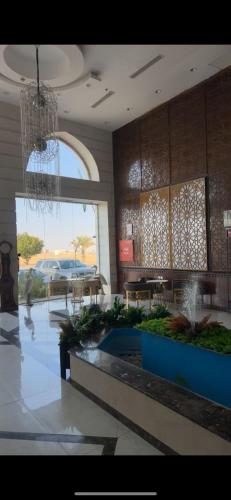 a lobby with a chandelier in a building at منتجع شاطي الاحلام in Yanbu