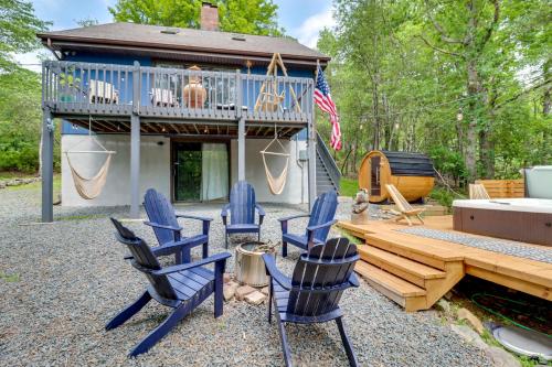 a backyard with chairs and a deck and a house at Hot Tub, Fire Pit and Barrel Sauna Poconos Abode in Long Pond