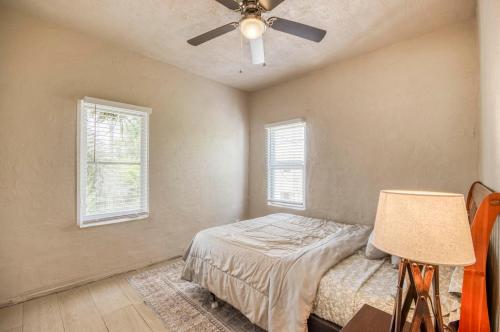 a bedroom with a bed and a ceiling fan at Historic Home near the water - perfectly walkable spot! in Lake Worth