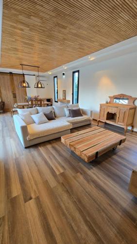 a large living room with two couches and a table at Casa Reserva Vip in Ciudad Lujan de Cuyo