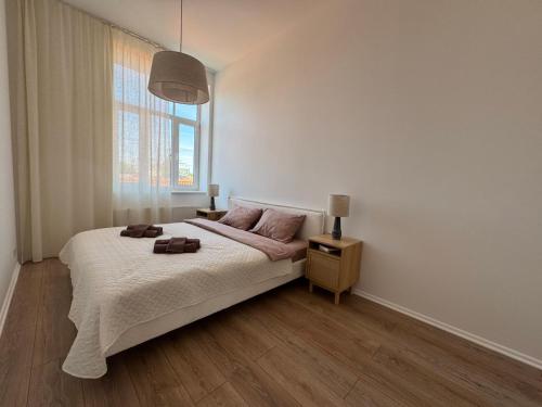 Ένα ή περισσότερα κρεβάτια σε δωμάτιο στο Sun Shine 1 apartment