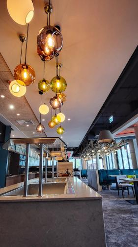 a room with many lights hanging from the ceiling at Mountain View Hotel Willingen, BW Signature Collection in Willingen
