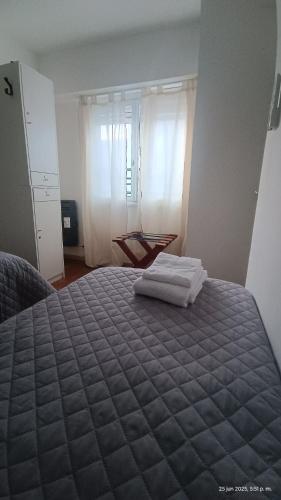 Ένα ή περισσότερα κρεβάτια σε δωμάτιο στο La Via Hostel
