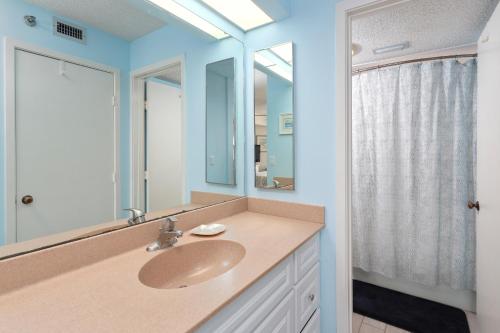 a bathroom with a sink and a mirror at North Breakers #407 in Saint Simons Island