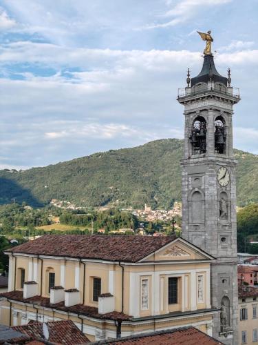 a building with a clock tower on top of it at Nonna ITA in Albino