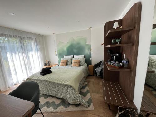Postel nebo postele na pokoji v ubytování Art de l'Ô chambre d'hôtes
