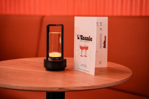 a lamp sitting on a table next to a book at ibis budget Marseille Vieux Port in Marseille
