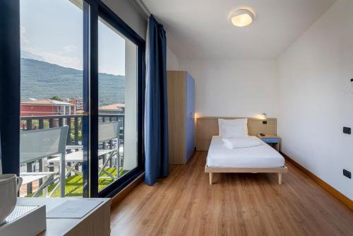 Hi Hotels Riva del Gardaにあるベッド