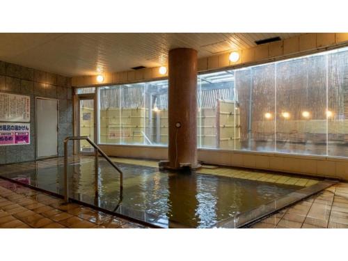 a room with a pool of water in a building at Hotel Symphony - Vacation STAY 31586v in Sagae