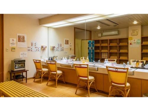 a waiting room with chairs and a large mirror at Hotel Symphony - Vacation STAY 31575v in Sagae