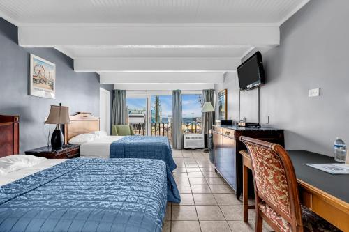 Postel nebo postele na pokoji v ubytování Aztec Ocean Resort